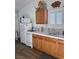 Simple kitchen with white appliances and wooden cabinets at 3581 Pahrump Valley Blvd, Pahrump, NV 89048