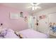 Cozy bedroom with a lavender color scheme and My Little Pony decor at 5044 Whistling Acres Ave, Las Vegas, NV 89131