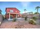 Two-story house with covered patio, backyard and landscaping at 9844 Ashton Pines Ct, Las Vegas, NV 89147