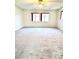 Spacious bonus room with natural light and carpeting at 9844 Ashton Pines Ct, Las Vegas, NV 89147