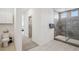 Contemporary bathroom with a glass-enclosed shower and modern fixtures at 10172 Magnolia Creek St, Las Vegas, NV 89141