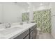 Bathroom with double vanity and walk-in shower at 10172 Magnolia Creek St, Las Vegas, NV 89141