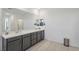 Double vanity bathroom with modern gray cabinets at 10172 Magnolia Creek St, Las Vegas, NV 89141