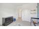 Bedroom with black dresser, crib, and additional closet space at 10172 Magnolia Creek St, Las Vegas, NV 89141