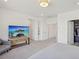 Well-lit bedroom with a calming atmosphere, featuring a TV and built-in shelving at 10172 Magnolia Creek St, Las Vegas, NV 89141