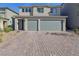 Two-story home with a three-car garage and paved driveway at 10172 Magnolia Creek St, Las Vegas, NV 89141