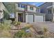 Two-story home features a two-car garage and low-maintenance desert landscaping at 10172 Magnolia Creek St, Las Vegas, NV 89141