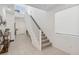 Bright, airy foyer with staircase and light tile flooring for a grand entrance at 10172 Magnolia Creek St, Las Vegas, NV 89141