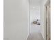 Hallway view leading to a bedroom with carpeted floors and neutral walls at 10172 Magnolia Creek St, Las Vegas, NV 89141