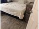 Bedroom with a bed, crib, and wood-look tile floor at 2813 Searles Ave, Las Vegas, NV 89101