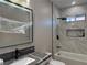 Bathroom with modern vanity, walk-in shower, and bathtub at 3060 Spy Glass Ave, Pahrump, NV 89048