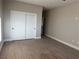 Bedroom with double door closet and wood flooring at 3060 Spy Glass Ave, Pahrump, NV 89048