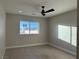 Spacious bedroom with ceiling fan and large window at 3060 Spy Glass Ave, Pahrump, NV 89048