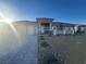 Modern home exterior with a two-car garage and stone accents at 3060 Spy Glass Ave, Pahrump, NV 89048