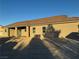 Single-story home with covered patio and a large backyard at 3060 Spy Glass Ave, Pahrump, NV 89048