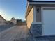 New home exterior features a modern design, two-car garage, and landscaped yard at 3060 Spy Glass Ave, Pahrump, NV 89048