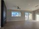 Open living room with hardwood floors, fireplace, and sliding glass doors at 3060 Spy Glass Ave, Pahrump, NV 89048