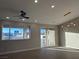 Bright and airy living room with hardwood floors and ceiling fan at 3060 Spy Glass Ave, Pahrump, NV 89048