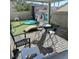 Patio with seating area, artificial turf, and play area at 7813 Blue Charm Ave, Las Vegas, NV 89149