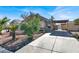 House exterior with driveway and landscaping at 4613 Painted Cliffs Dr, Las Vegas, NV 89108