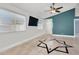 Bright living room features tile floors, a ceiling fan and neutral wall colors at 4613 Painted Cliffs Dr, Las Vegas, NV 89108