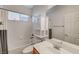 Full bathroom with a combination tub and shower and wooden vanity and cabinet at 7943 Sleeping Lily Dr, Las Vegas, NV 89178