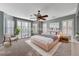 Digitally staged primary bedroom with neutral walls and decor and natural light at 7943 Sleeping Lily Dr, Las Vegas, NV 89178