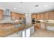 Open concept kitchen with granite countertops, stainless steel appliances, and center island with a sink at 7943 Sleeping Lily Dr, Las Vegas, NV 89178