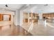 The open kitchen features custom cabinets, a center island, and tiled flooring at 7943 Sleeping Lily Dr, Las Vegas, NV 89178