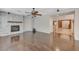 The spacious living room boasts hardwood floors and a modern stone fireplace at 7943 Sleeping Lily Dr, Las Vegas, NV 89178
