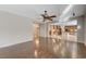 Open floor plan with hardwood floors connects to the kitchen and dining areas at 7943 Sleeping Lily Dr, Las Vegas, NV 89178