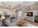 Virtual Staging: Open-concept living room and dining area with modern decor and a grand staircase at 7943 Sleeping Lily Dr, Las Vegas, NV 89178