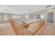 Second-story loft with decorative cutouts overlooking the downstairs living area at 7943 Sleeping Lily Dr, Las Vegas, NV 89178