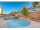 Backyard pool with stone accents and a waterfall feature, set against a clear sky at 7943 Sleeping Lily Dr, Las Vegas, NV 89178