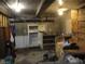 Unfinished basement with appliances and storage boxes at 4243 E Carey Ave, Las Vegas, NV 89115