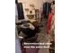 Cluttered downstairs bedroom with a cat at 4243 E Carey Ave, Las Vegas, NV 89115