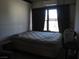 Small bedroom with a double bed and window at 4243 E Carey Ave, Las Vegas, NV 89115