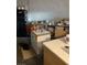A cluttered kitchen with appliances and cabinets needing some cleaning at 4243 E Carey Ave, Las Vegas, NV 89115