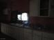 Kitchen with white cabinets and a window at 4243 E Carey Ave, Las Vegas, NV 89115