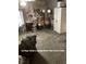 A cluttered living room with a table and chairs at 4243 E Carey Ave, Las Vegas, NV 89115