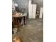 A cluttered living room with a table and cabinets at 4243 E Carey Ave, Las Vegas, NV 89115