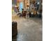 A cluttered living room with a table and chair at 4243 E Carey Ave, Las Vegas, NV 89115