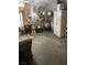 A cluttered living room with a table and chairs at 4243 E Carey Ave, Las Vegas, NV 89115