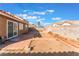 Landscaped backyard with patio and block wall at 6370 Canyon Vista Ct, Las Vegas, NV 89156