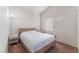 Well-lit bedroom with wood-look flooring and a light wood bed frame at 6370 Canyon Vista Ct, Las Vegas, NV 89156