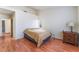 Spacious bedroom with wood floors and ample natural light at 6370 Canyon Vista Ct, Las Vegas, NV 89156