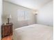 Bright bedroom with a double bed, nightstand, and window coverings at 6370 Canyon Vista Ct, Las Vegas, NV 89156