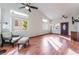 Spacious living room with hardwood floors, a ceiling fan, and ample natural light at 6370 Canyon Vista Ct, Las Vegas, NV 89156