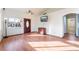 Living room with hardwood floors, a ceiling fan, and a view of the front door at 6370 Canyon Vista Ct, Las Vegas, NV 89156