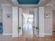 Elegant entryway with decorative columns, marble floors, and views into the living area at 7125 Mountain Den Ave, Las Vegas, NV 89179